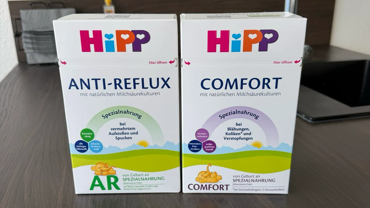 The German HiPP Anti-Reflux and Comfort boxes side by side on a kitchen counter, fronts to the camera.