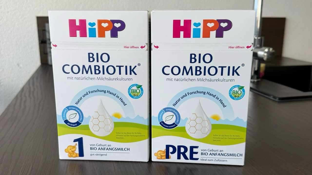 The German HiPP Bio Combiotik Stage 1 and PRE boxes side by side on a kitchen counter, fronts to the camera.